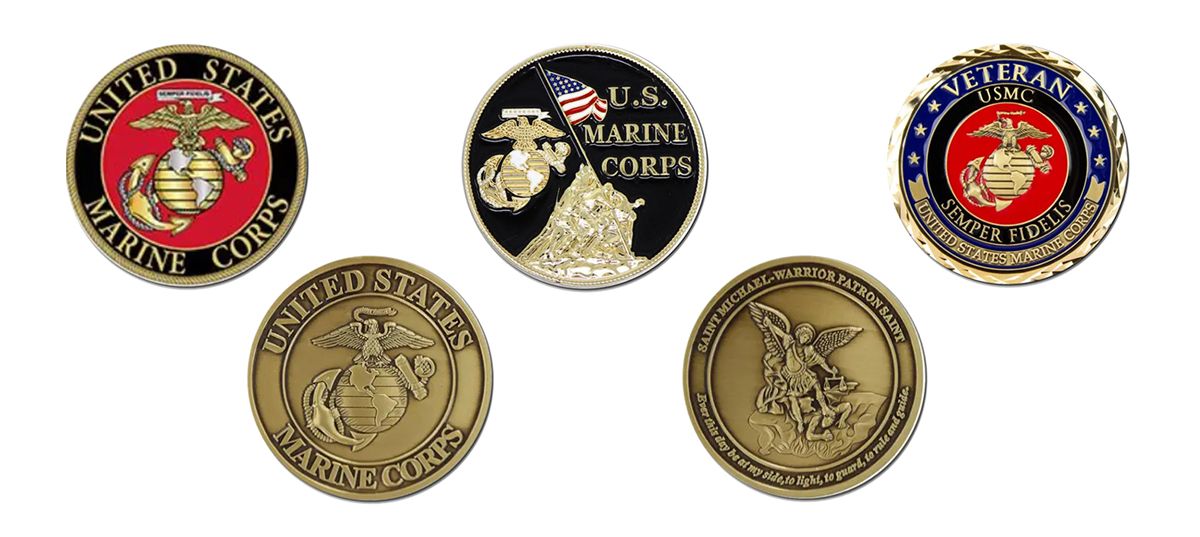 five Marine Corps challenge coins on a white background