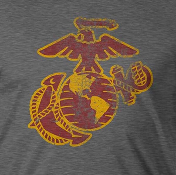 a vintage look Eagle, Globe, and Anchor in red and yellow on a gray Marines shirt