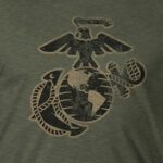 a vintage look Eagle, Globe, and Anchor in coyote and black on a green Marines shirt