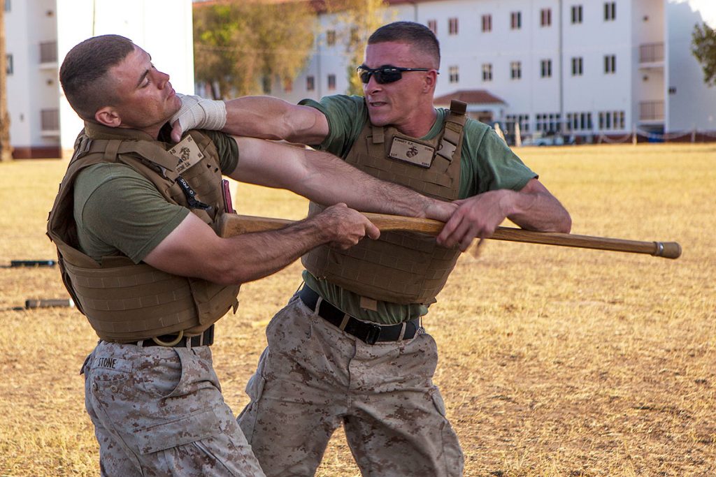 A U.S. Marine disarms his opponent and places a well aimed punch to the throat during hand-to-hand combat training.