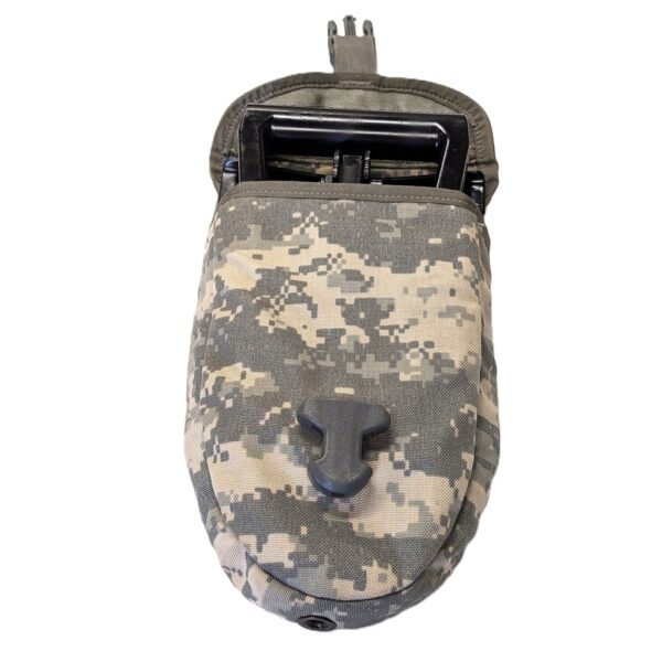 an open Army UCP camouflage e-tool carrier with a black Gerber entrenching tool inside