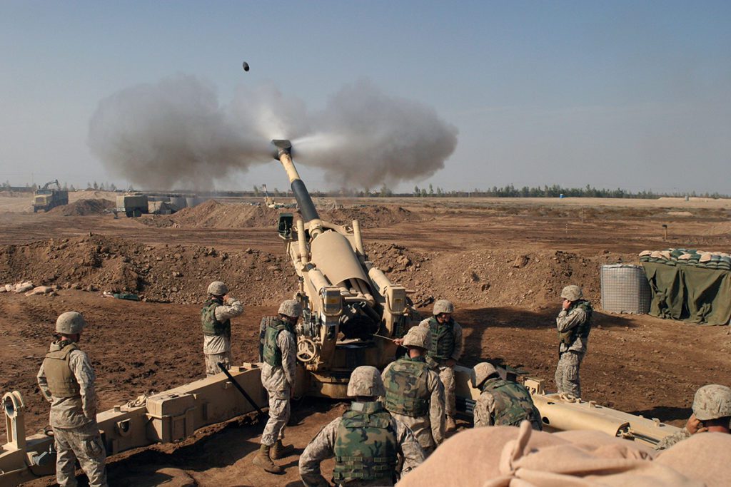 USMC Marines firing howitzer