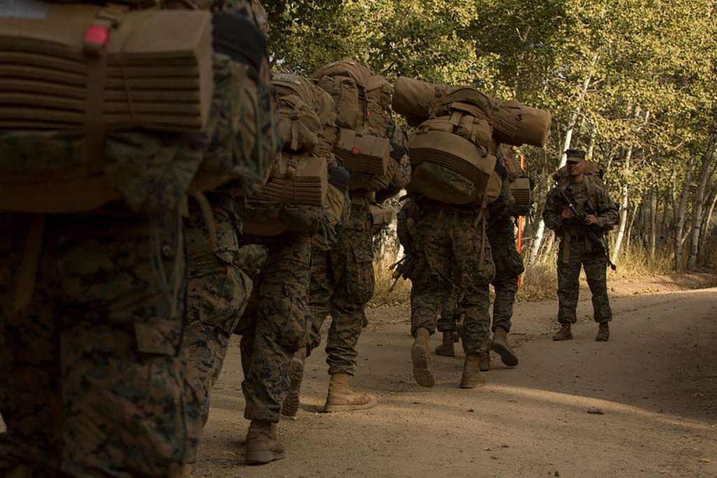 Marines rucking (weighted backpack training) at bootcamp