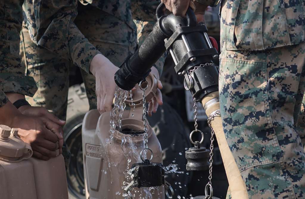 US Marines filling water canteens for pt