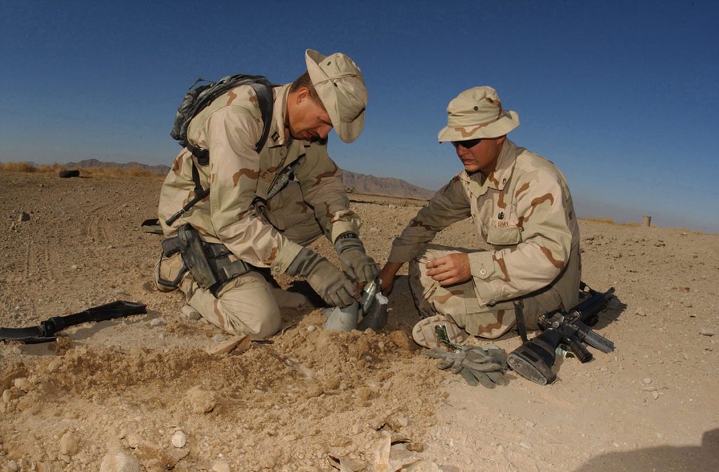 A US Marine and Army soldier wearing boonie hats in Afghanistan