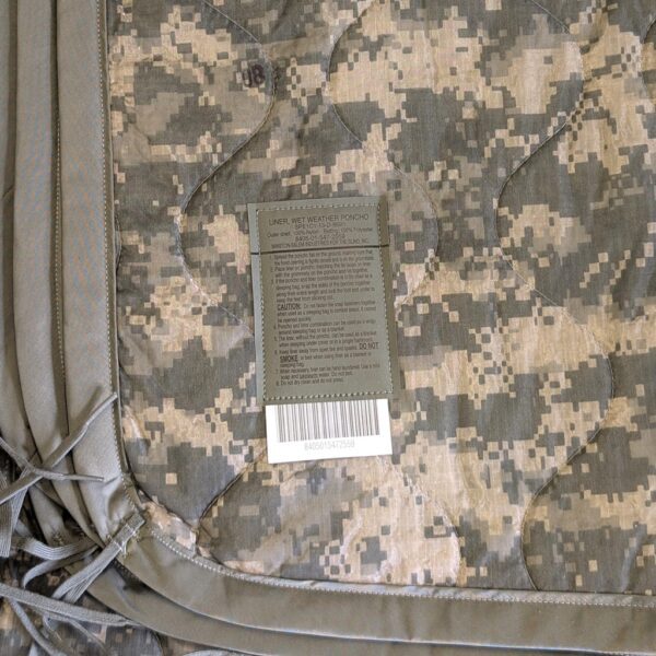 an Army ACU wet weather poncho liner in UCP camo