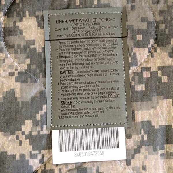 an Army ACU wet weather poncho liner in UCP camo