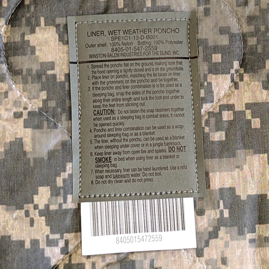 an Army ACU wet weather poncho liner in UCP camo