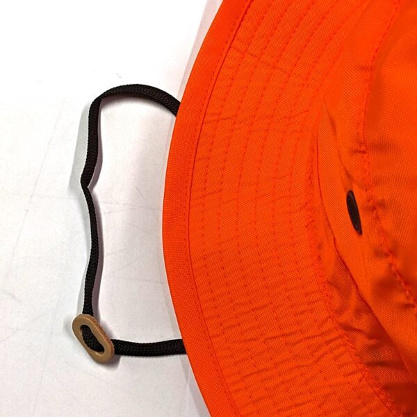 an adjustable chin strap on a wide brim blaze orange sun hat