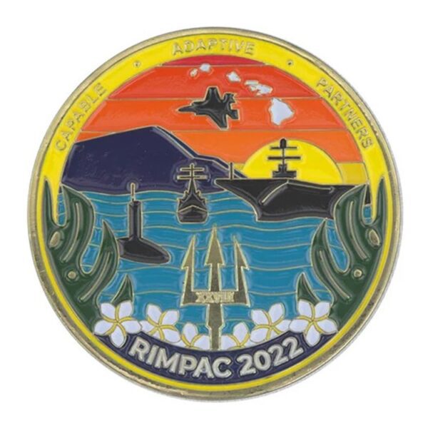 a colorful challenge coin with a colorful maritime warfare exercise and the words "RIMPAC" and "Capable, Adaptive, Partners."