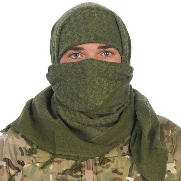 a solider wears a green tactical shemagh scarf