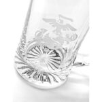 closeup photo of a clear glass beer mug with a Marine Corps EGA logo