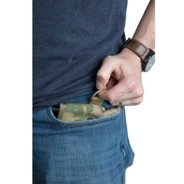 a man pulls a camouflage walking wallet from his jeans