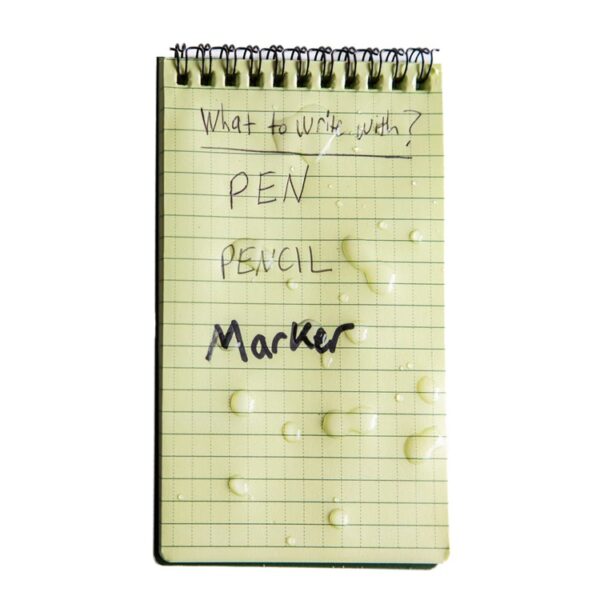 a wet waterproof notebook with "pen," "pencil," and "marker" written on it