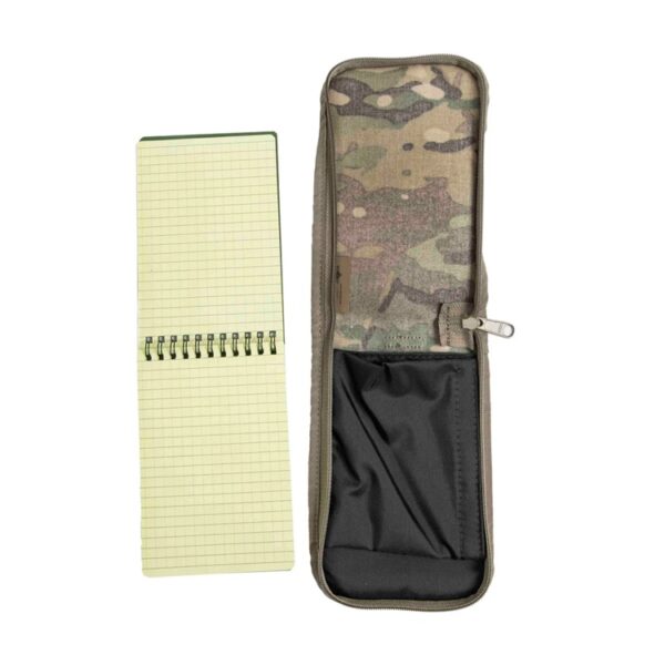 an open waterproof notebook with yellow-green pages and a camouflage notebook