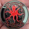 a MALS-11 Devilfish black US Marine Corps challenge coin with a red octopus