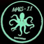 a MALS-11 Devilfish US Marine Corps challenge coin with a glow-in-the-dark octopus and "San Diego"