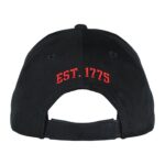 the back of a black twill US Marine Corps hat with Est. 1775 embroidered in red