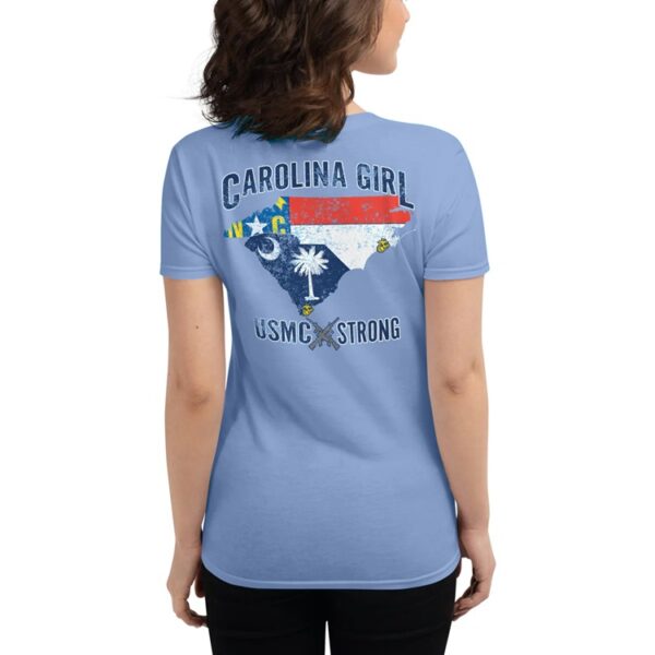 a woman wearing a sky blue shirt that says "CAROLINA GIRL" "USMC STRONG" and features North Carolina and South Carolina