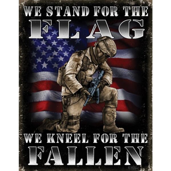 a sign with a kneeling soldier with a US flag behind that says "We stand for the flag, we kneel for the fallen"