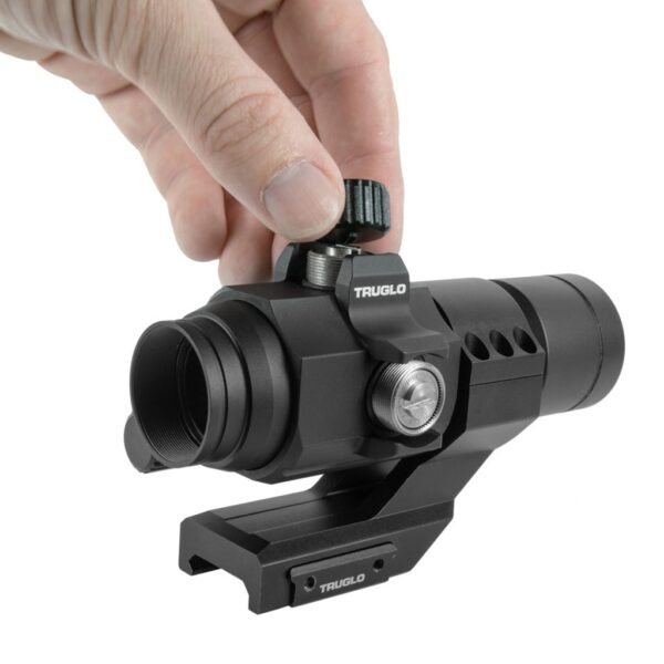 a hand adjusts a TRUGLOW 30mm Red Dot Sight