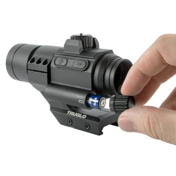 hand adjusts the battery of a TRUGLOW 30mm Red Dot Sight