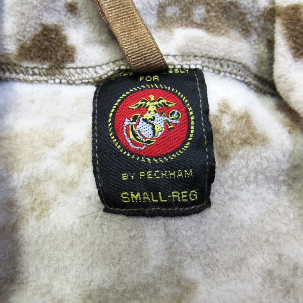 the tag with the US Marine Corps logo on a Polartec Wind Pro Fleece Jacket