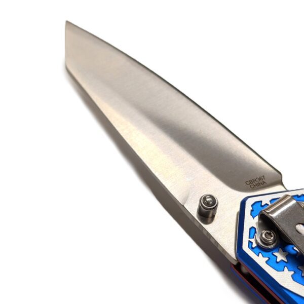 the blade of a stainless steel American flag pocket knife