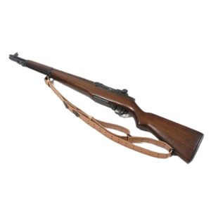 an M1 Garand rifle with a brown leather M1907 rifle sling