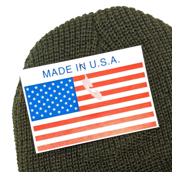 a Made in USA tag on a new performance acrylic knit beanie