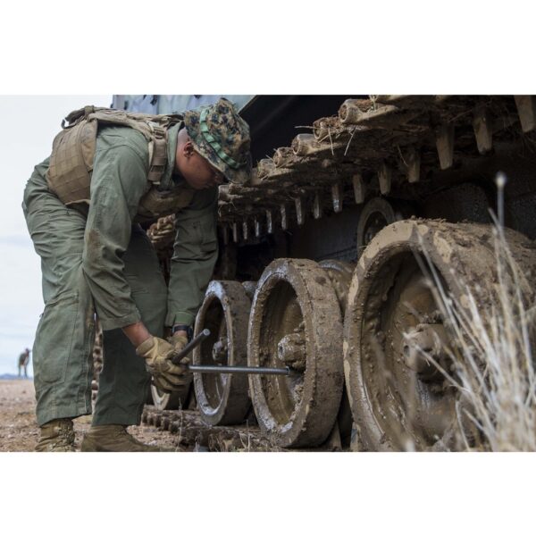 a US Marine Corps mechanic in woodland MARPAT cammies wearing Mechanix M-Pact Gloves