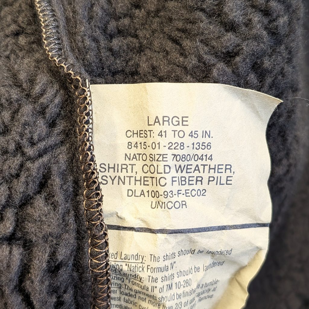 tag of a brown and black USGI cold weather bear suit