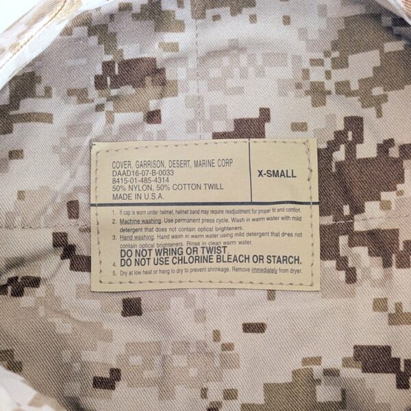 the inside tag of a desert MARPAT camouflage 8-point utility cover (garrison cap) for the US Marine Corps Young Marines