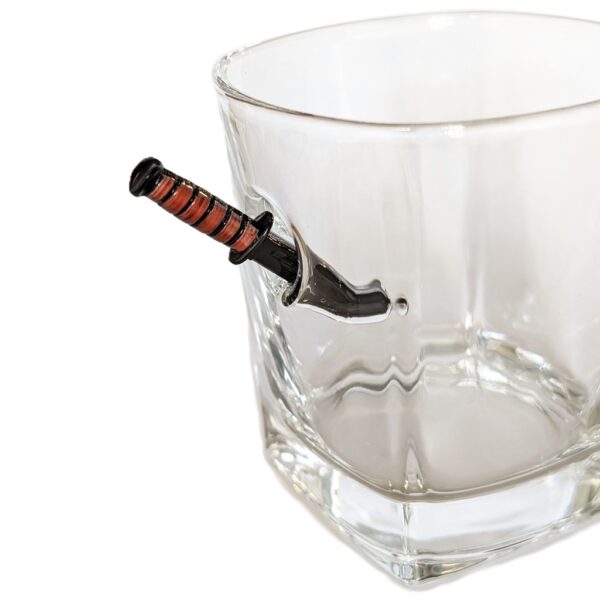 a US Marine Corps whiskey glass with a miniature KABAR combat utility knife replica sticking into the glass