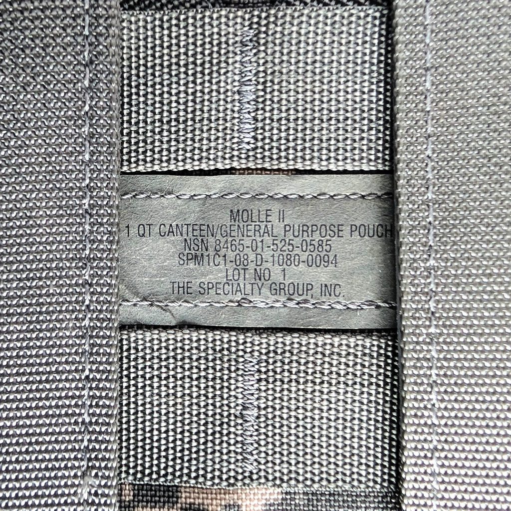 a US Army-issue military surplus UCP camouflage 1 quart canteen cover/general purpose pouch