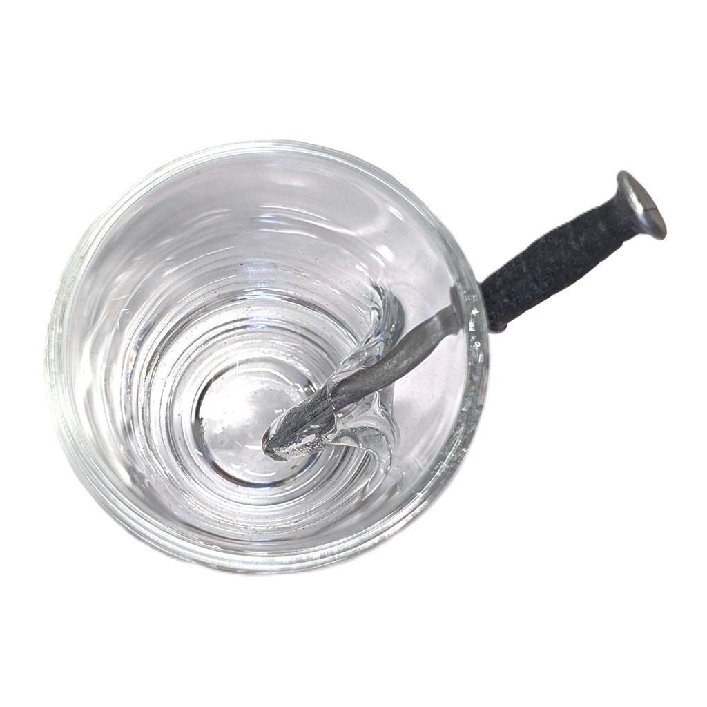 a US Marine Corps shot glass with an EGA and an embedded combat knife replica