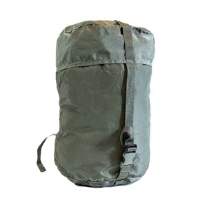 a foliage green US Army small compression stuff sack, part of the Improved Modular Sleep System (IMSS)