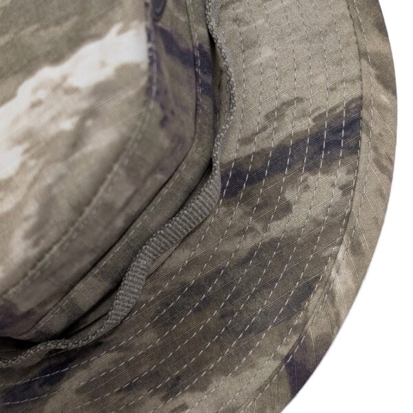 an A-TAC AUX (arid urban) camouflage USGI boonie cover (jungle hat)