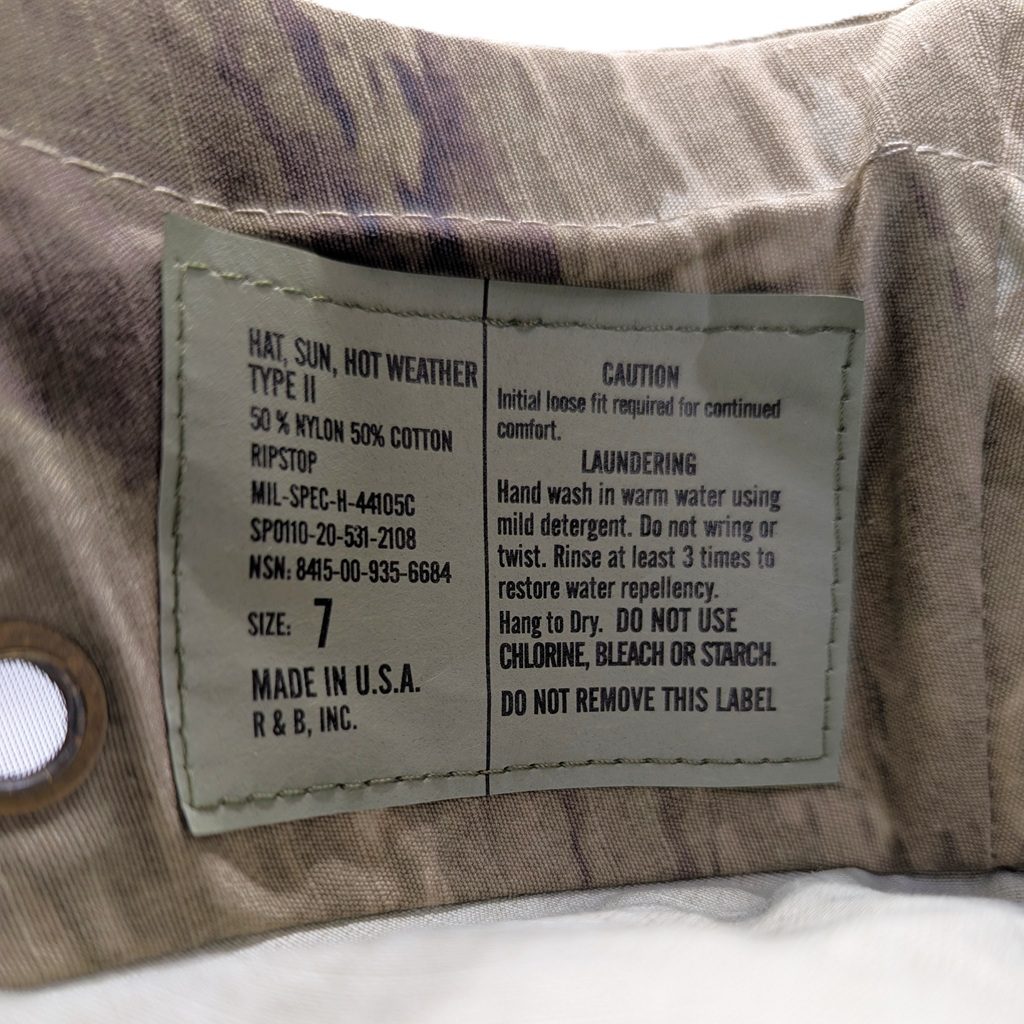 an A-TAC AUX (arid urban) camouflage USGI boonie cover (jungle hat)