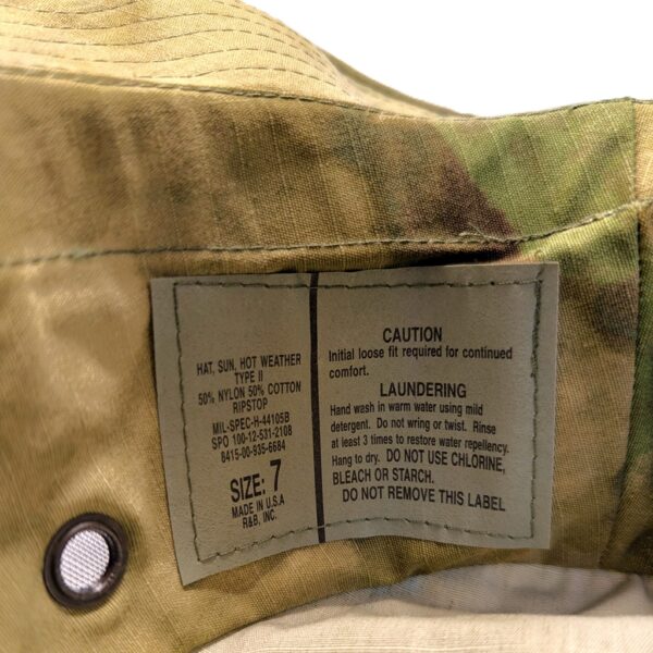 a foliage green woodland camo A-TACS USGI boonie cover