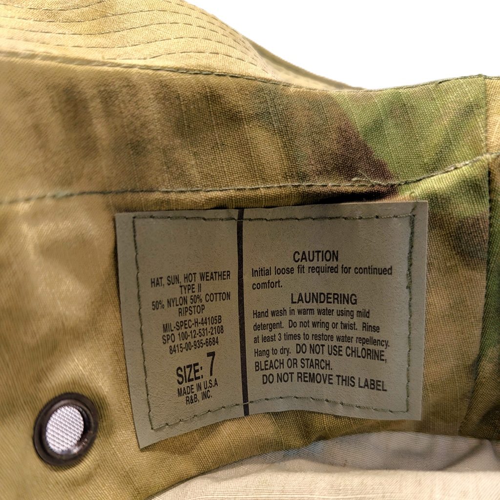 a foliage green woodland camo A-TACS USGI boonie cover