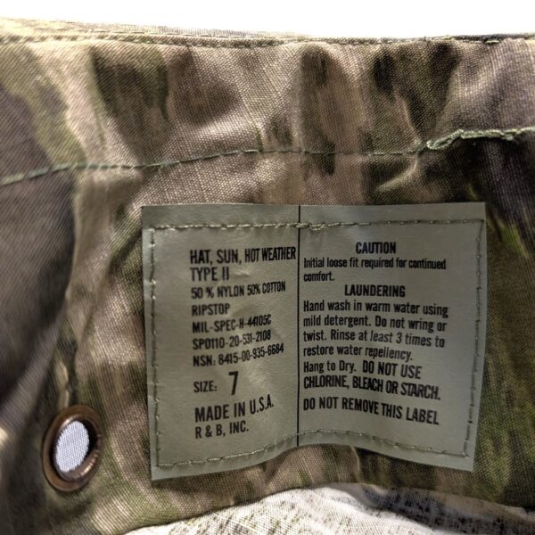 an intermediate camo A-TACS iX USGI boonie cover