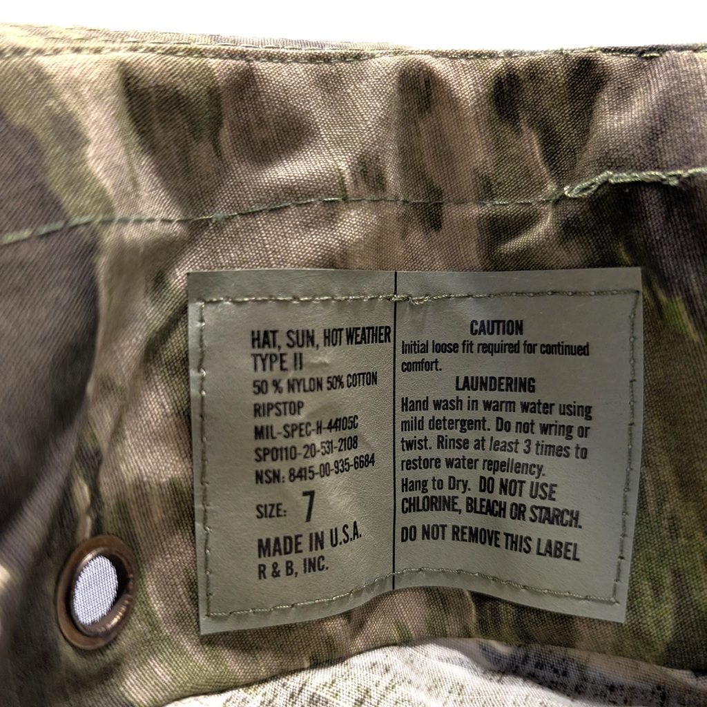 an intermediate camo A-TACS iX USGI boonie cover